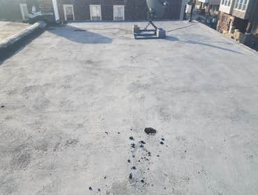 Before and after torchdown modified granulated rubber roof