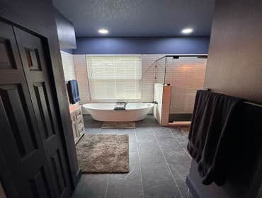 Pointview Primary Bath This Pointview primary bathroom remodel in Orlando was a full transformation built around clean finishes and a bold use of color