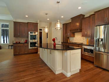 Lockridge Residence This new Transitional Custom Home was built on the owners heavily wooded lot and designed to maintain the woodsy feel while taking 