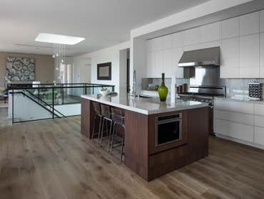 Tiburon house Install hardwood flooring throughout house - wide plank white oak with cured urethane finish