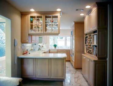 1992: Clean and Neutral Kitchen & Bath This Mount La Jolla condo got a new larger kitchen by adding 3 feet in depth by moving the sink wall out under a