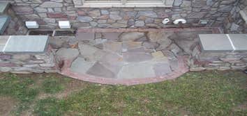 moore job this is outside stairs, seating area, sunk in play area with fire pit. intertaining area