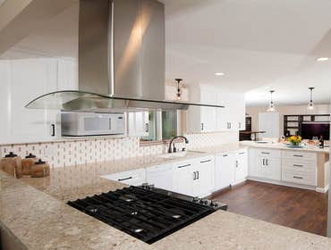 Carlsbad Kitchen Full remodel with 12 foot Island completed with granite counter tops.
New hard wood flooring to match.