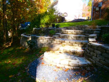 Stone Terraced Retaining Walls Our client wanted to have Cabana Boys install a retaining wall. We designed a four tiered, terraced wall with steps dow
