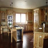 Mountain Rose High above the hamlet of Martin City and the Northfork of the Flathead River sets a property that defies description. The family compoun