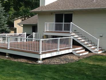 Photos by Custom Home Specialties Inc #2 Timber Tech maintenance free decks with powder coated railings.