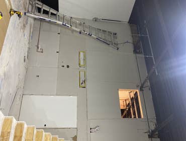 Drywall install. Drywall install in warehouse.