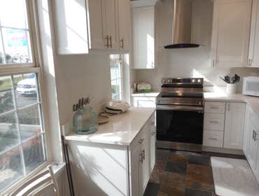 Photos by Best Home Improvements Nw LLC #4 Office Kitchen Remodel to Include - New cabinets, Quartz Countertops, Additional Cabinets, SS Wall Mount Ran
