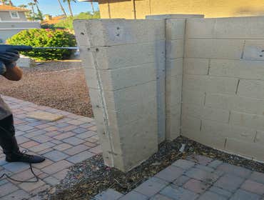 Photos by Alpha Commercial Doors LLC #1 Block wall removal process to widen RV gates.