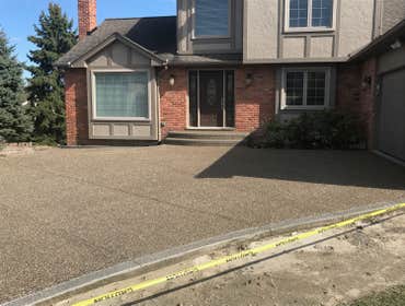 exposed aggregate Driveway Photo by Potoroka Concrete Macomb MI