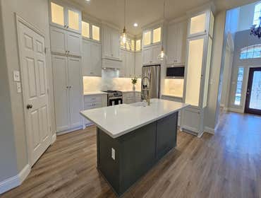 Photos by Trublue of Allen #37 Allen TX. Full kitchen remodeling: Demolition of columns and installation of load bearing structure. New island, cabinet