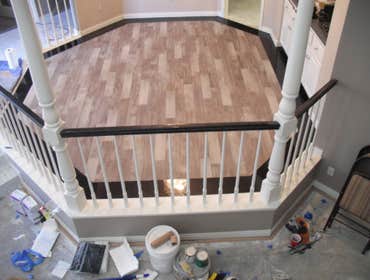 Photos by Floored #1 8 inch Galaxy Granite border.4 ix 24 inch Porcelian plank tile inlay.