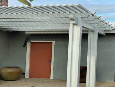 Photos by Pacific Proworks Inc. A beautifully blended project featuring a new patio cover, sleek vinyl gate and blockwall fencing, stylish pavers, cust
