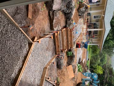 Custom Boulder Wall/Step System with Recessed Lighting as Part of Landscape Design