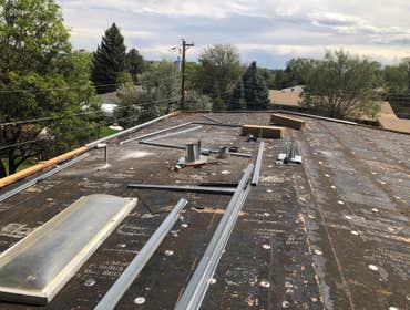 Flat Roof - Self-adhered peel and stick modified bitumen roof Re-roofed a residential property with a flat roof.