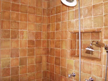 Natural stone restoration 2007 Saltillo tiles shower efflorescence removal and sealing. Natural stone sometimes requires a little more care against it'