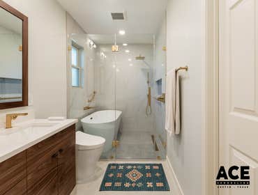 Whispers of Luxury- Bathroom Remodel Experience the ultimate in relaxation with this luxurious bathroom remodel featuring a spacious walk-in shower and