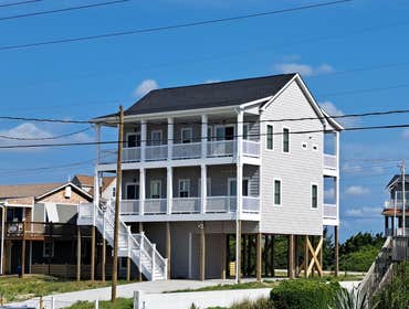 Photos by Future Homes #6 Two Story Reverse Floor Plan Beach Home, Elevator