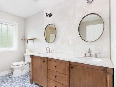 Master Bathroom - Bathroom remodel featuring custom double vanity, tile backsplash, and updated plumbing fixtures