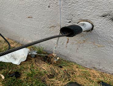 Drain cleaning through kitchen sink cleanout in Ventura