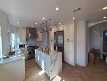 Photos by Gar Builders Inc #4 Complete remodel. 5 new bathrooms, wet room, butlers pantry, new banister, custom wood trim in the office, level 5 drywal