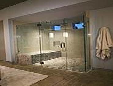 Glass Shower Enclosure and Door Remodeled bathroom with a new glass shower enclosure and door.