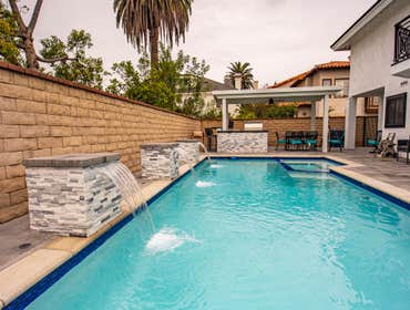 Front, back, and pool remodeling HB building new front yard, fences, gates, pavers for front and backyard, custom BBQ, aluminum patio cover, complete p