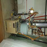 Photos by Dimatic Control LLC #4 Furnish and Install Hot water baseboard boiler and radiators with three zones for home.