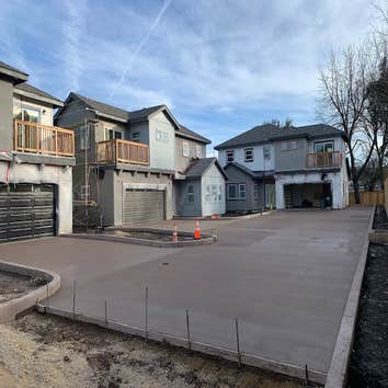 Curbaril Project A four home development. Installed foundations, site fencing, curbs, and driveways.