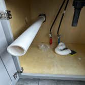 Photos by Des in the Cut Construction Company #1 We replaced a plastic, double-sink drain with pvc pipes, two P-traps and installed a vent so the water
