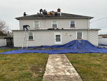 Photos by Flores Home Improvement LLC #1 Roof replacement paint wainscoting installation frame and drywall installation