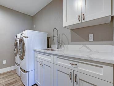 Westwood Laundry Room Remodel For this full home remodel we upgraded the laundry room. We added recessed LED lights, light hardwood floors, hardwood st