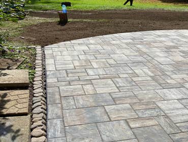 Photos by Steve Danylko Land Service #1 New lawn and landscaping