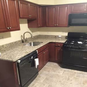 Photos by J. Roberts Installations #5 kitchen remodel in a condo. this kitchen has new cabinest and appliances. sheet vinyl flooring