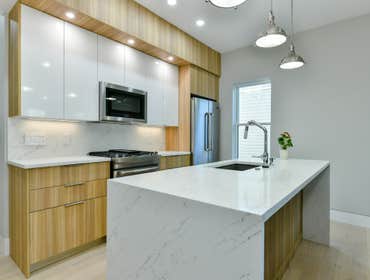 Photos by Urbanity Homes #1 Maverick St Boston MA
The Maverick Street condos are a study in materials. Simple geometries are given interest with contra