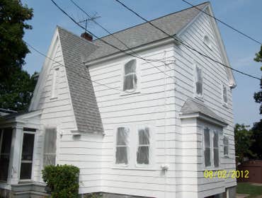 Brilliant Painting, LLC Exterior Project 1 Before and after photos of a full house that has been power washed, scraped, hand sanded, primed, and painte