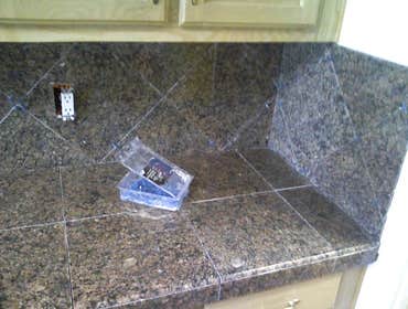 Othello Kitchen Granite/Porcelain Tile Work Kitchen Countertops and Backsplash done in Granite tile with hand beveled and polished edges and floors don