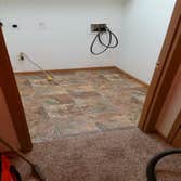 Flooring Removed old flooring down to the slab and re installed new flooring and trim
