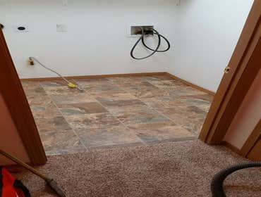 Flooring Removed old flooring down to the slab and re installed new flooring and trim