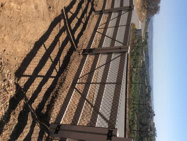 4 horse rail vinyl gate.