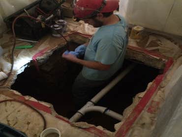 Sewer line repair through slab