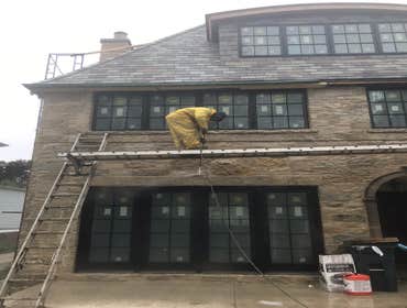 Photos by Excavo Construction Co #10 Power washing new construction building