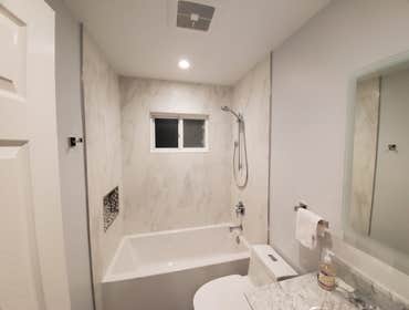 Bathroom Remodel We're thrilled to share the completion of this project – a stunning bathroom transformation for our wonderful client! This tub-to-tub 