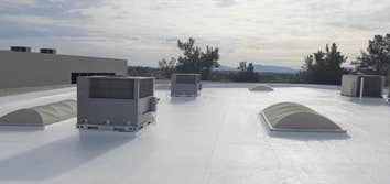 Silicone commercial roof restoration by Level 1 Roofing Inc