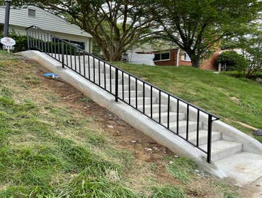 Concrete steps with iron rails