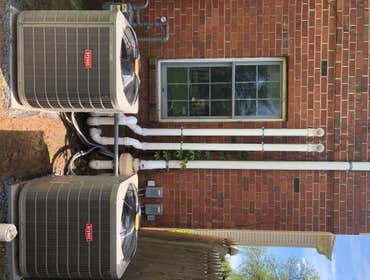 Photos by Stellitano Heating and Air Conditioning, Inc #10 Installation of Air conditioning condensers.