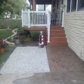 Project photos from A.J. Garreffi Construction Remove existing painted railing and replace with all vinyl
also replace concrete steps and and install p