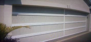 Retractable garage screen door