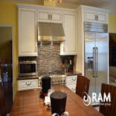 Barnsley Kitchen The Barnsley Kitchen remodel is one of our finest yet. The corian countertops, mosaic tile backsplash, brown high top table and nickel