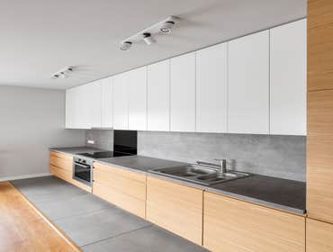 Photos by EOL Builders #69 Contemporary kitchen furniture with long, grey countertop and modern kitchenware